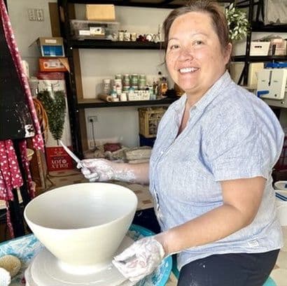 Juni Margrie at the potter’s wheel in her studio